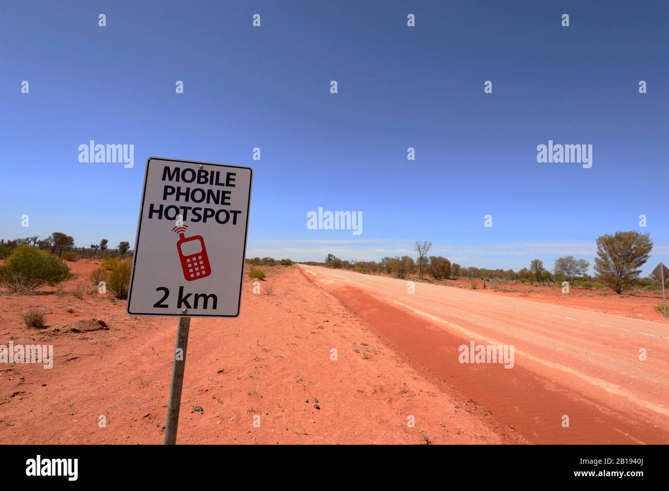 Mobile Phone Hotspot sign along a dirt road in the Australian Outback, Northern Territory, NT, Australia Stock Photo