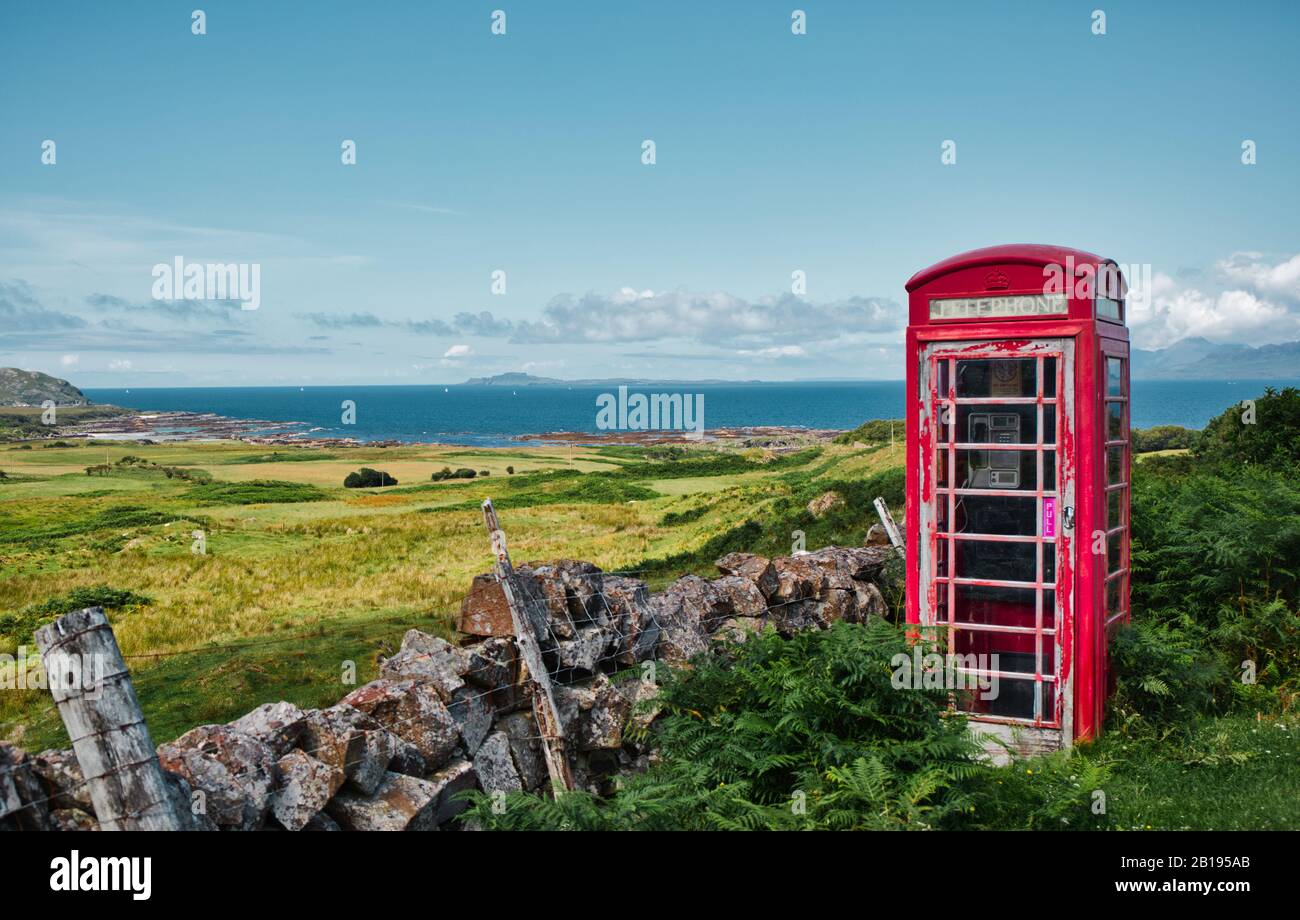 Remote red British telephone box and view of the Atlantic Ocean, Ardnamurchan Peninsula, Lochaber, Highland, Scotland Stock Photo
