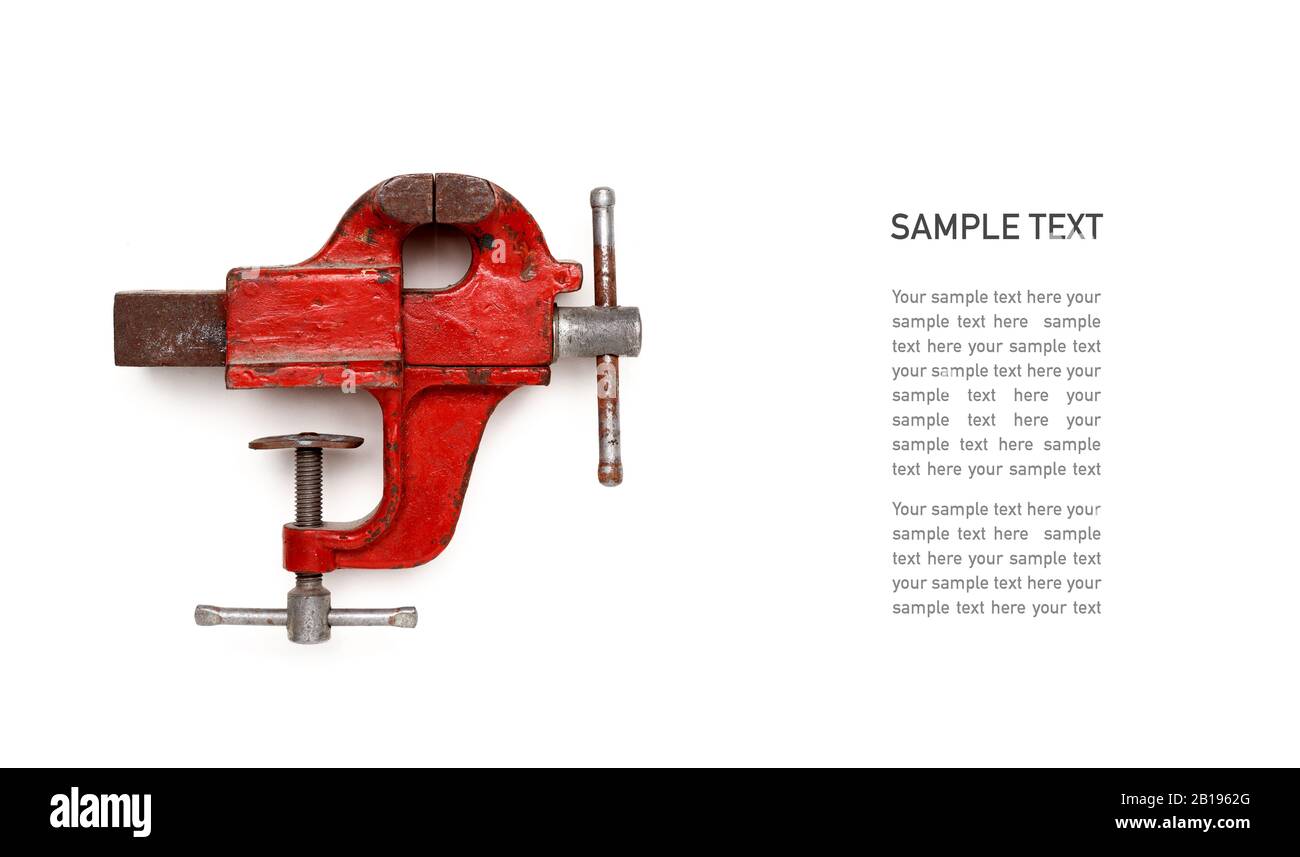 Metalwork tool - red vintage mechanical hand vise clamp on white background with copy-space and Sample text Stock Photo