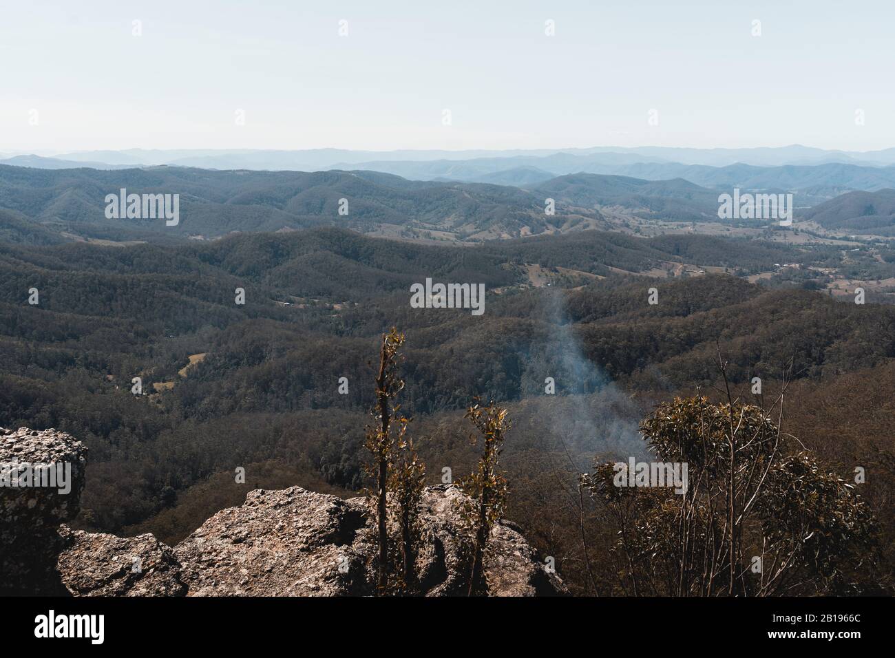 Mount Comboyne - December 30th 2019: Spot fire smoke as seen from the top of Mount Comboyne before a helicopter drops water to extinguish it. Stock Photo