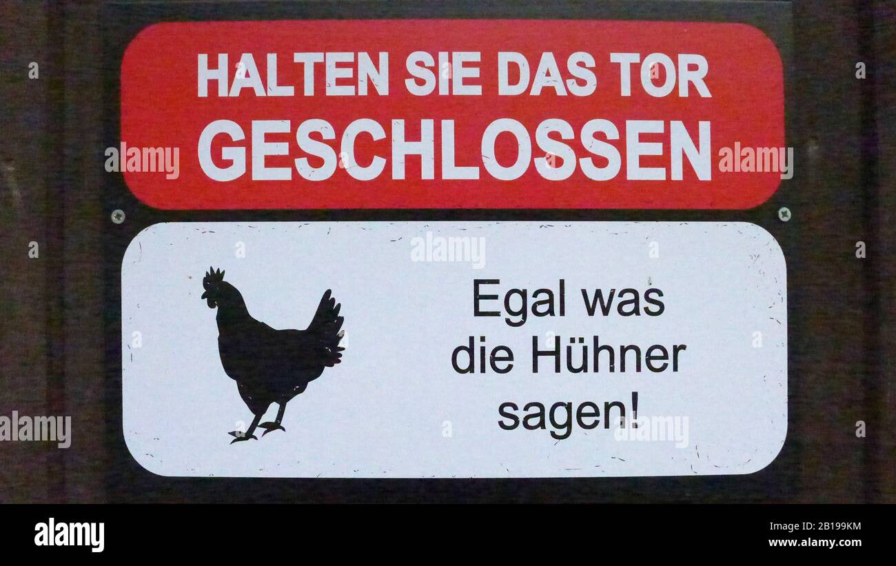 domestic fowl (Gallus gallus f. domestica), sign at a chicken coop, keep door close, Germany Stock Photo