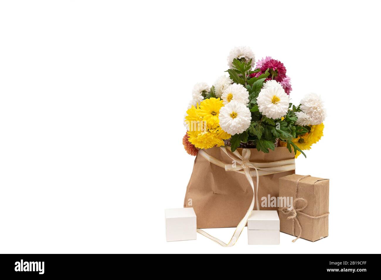 Bouquet of flowers and gift box on white background Stock Photo