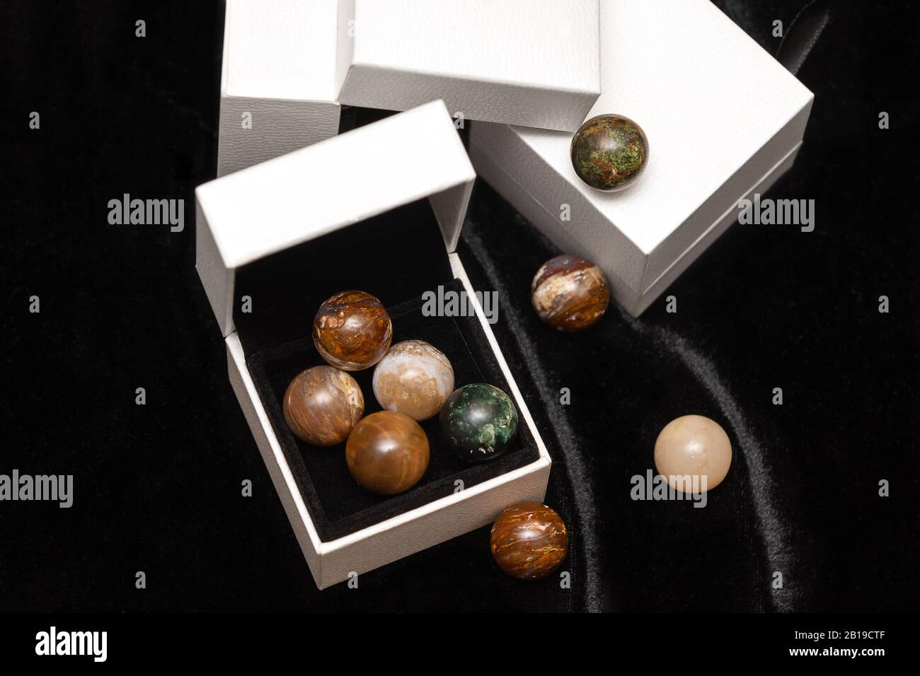 Sets of round stones on black background. Stock Photo