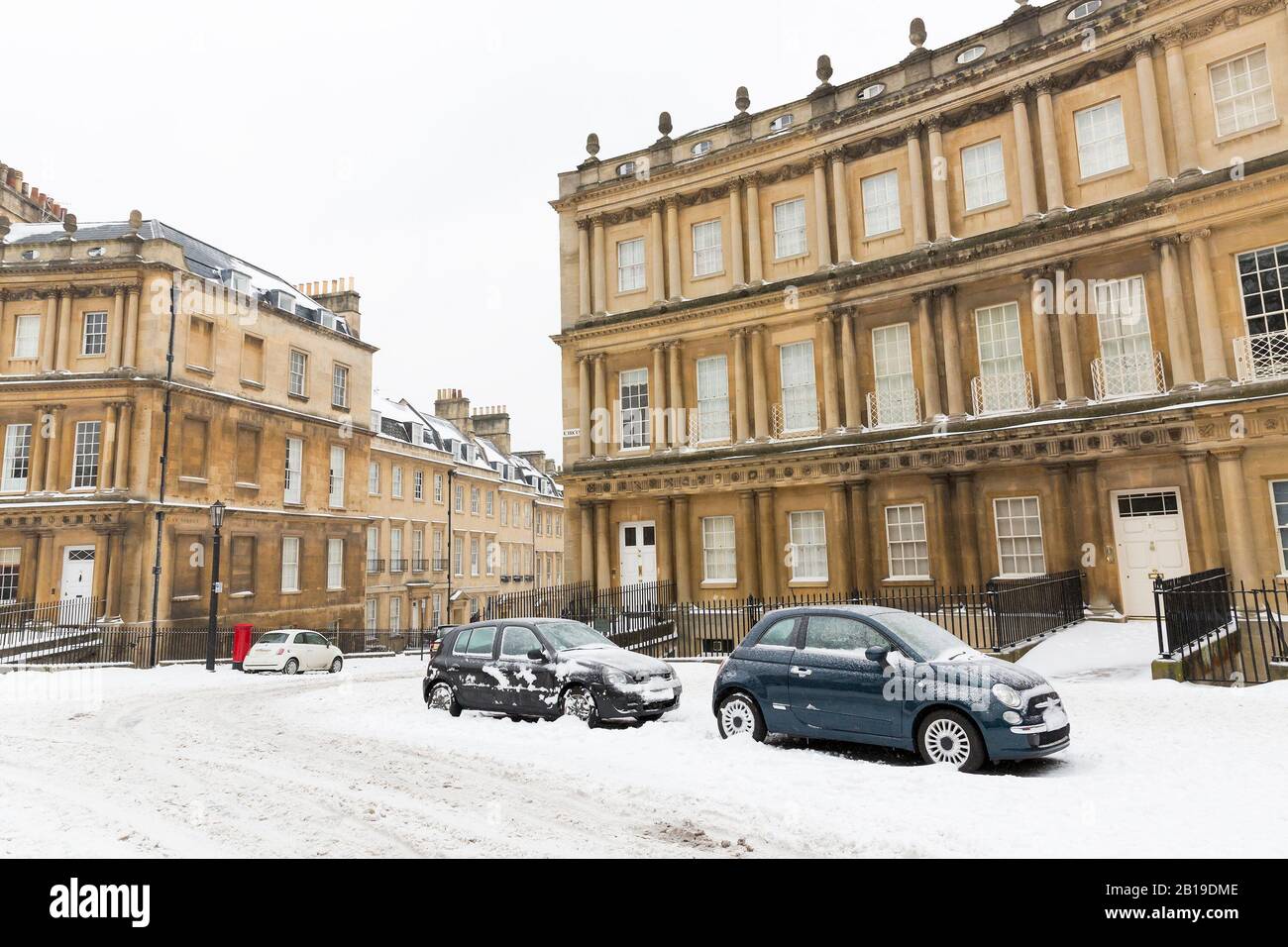Snowy conditions at the Circus, a Georgian terraced Street in Bath, England. Stock Photo