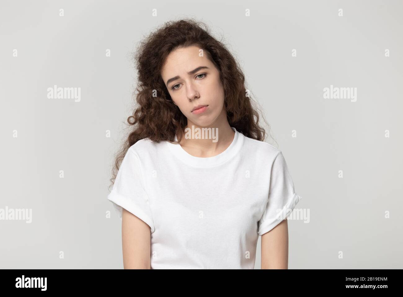 Depressed upset sad millennial woman feeling frustrated. Stock Photo