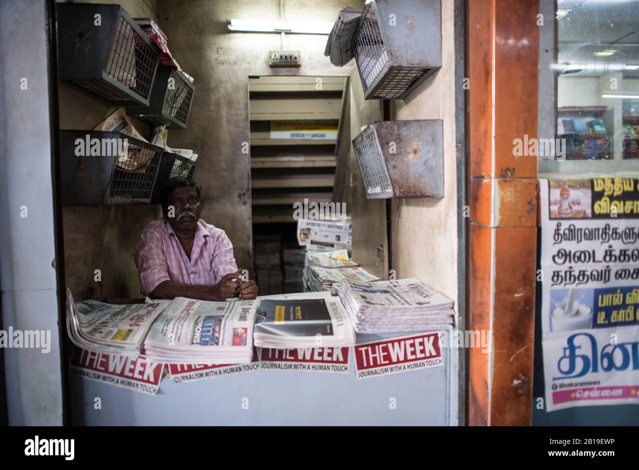 Newspaper vendor. Chennai Central Railway Station, Chennai, Tamil Nadu. South India. Stock Photo