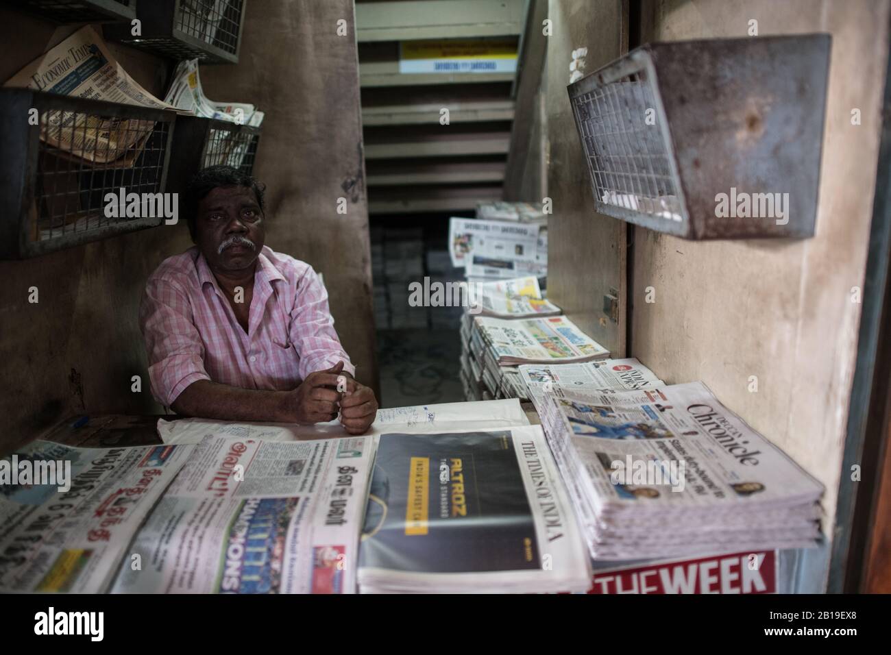 Newspaper vendor. Chennai Central Railway Station, Chennai, Tamil Nadu. South India. Stock Photo
