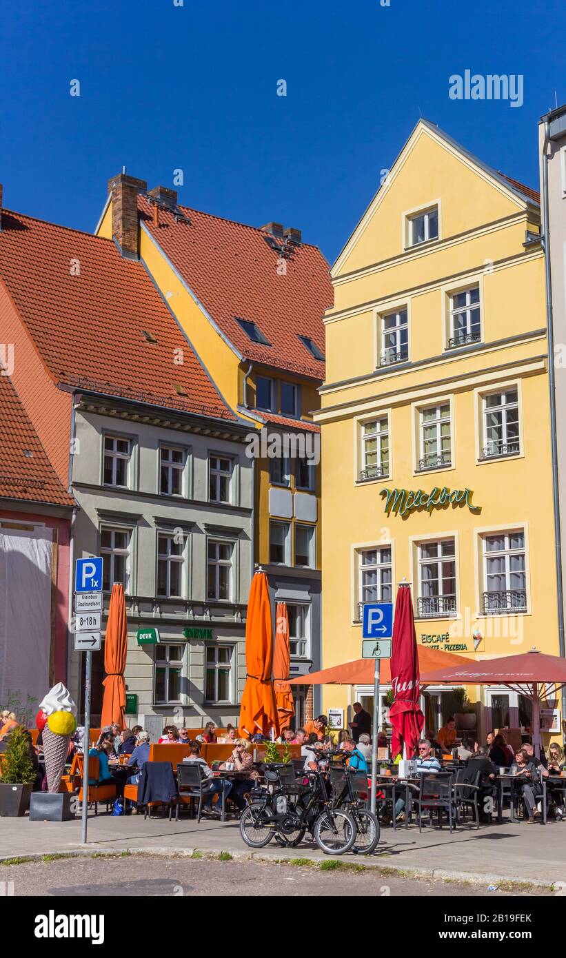 People enjoying the sun at a cafe in Stralsund, Germany Stock Photo - Alamy