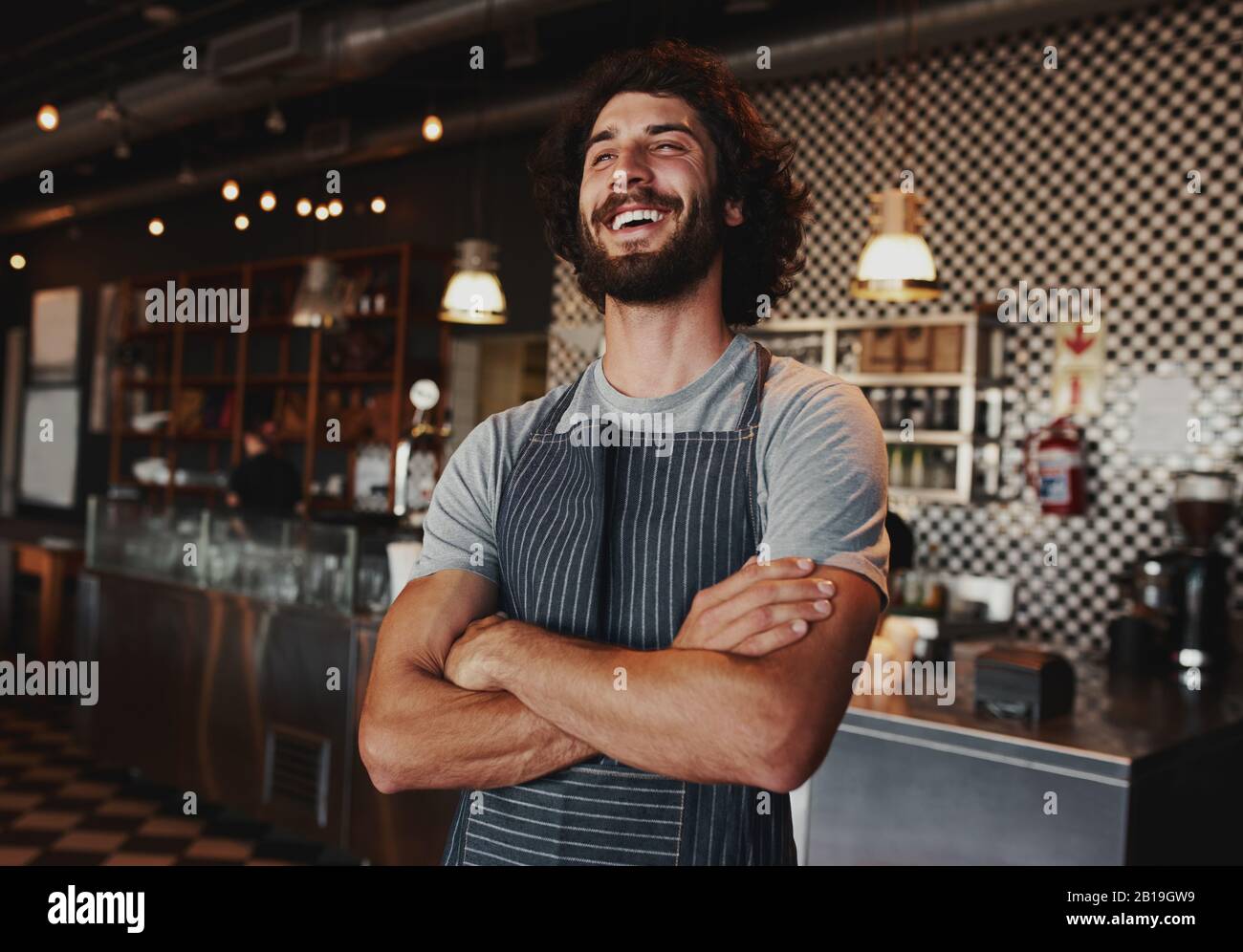 Man wearing apron arms folded hi-res stock photography and images - Alamy