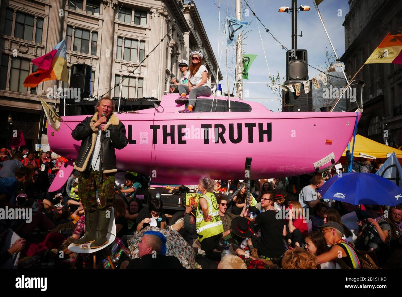 Extinction Rebellion, occupy London: Starting from Monday 15 April 2019, Extinction Rebellion organised demonstrations in London, focusing their attention on Oxford Circus, Marble Arch, Waterloo Bridge and the area around Parliament Square. Activists fixed a pink boat named after murdered Honduran environmental activist Berta Cáceres in the middle of the busy intersection of Oxford Street and Regent Street (Oxford Circus) and glued themselves to it and also set up several gazebos, potted plants and trees, a mobile stage and a skate ramp whilst also occupying Waterloo Bridge (ref:Wikipedia). Stock Photo
