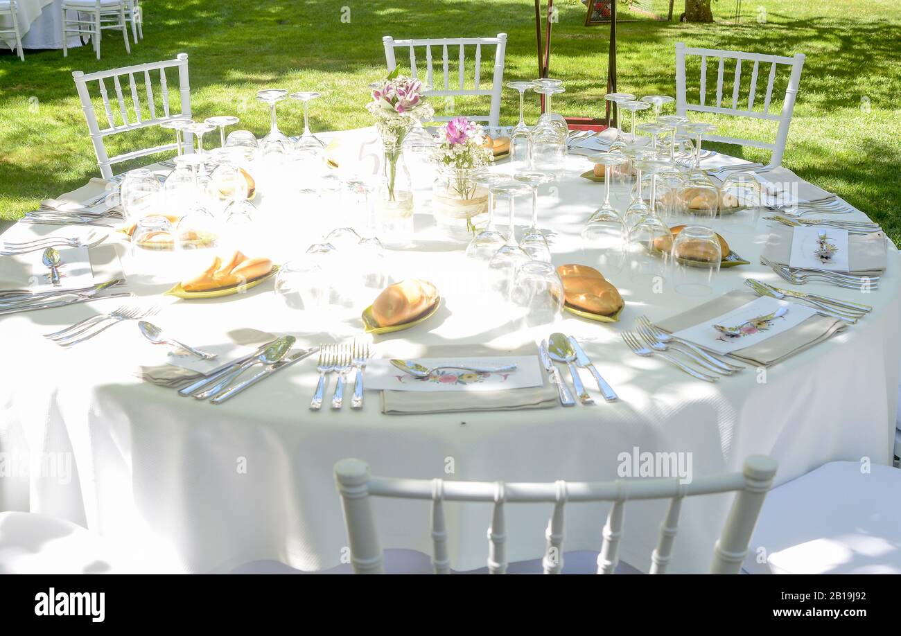 Decoration and utensils on a table with chairs prepared for the