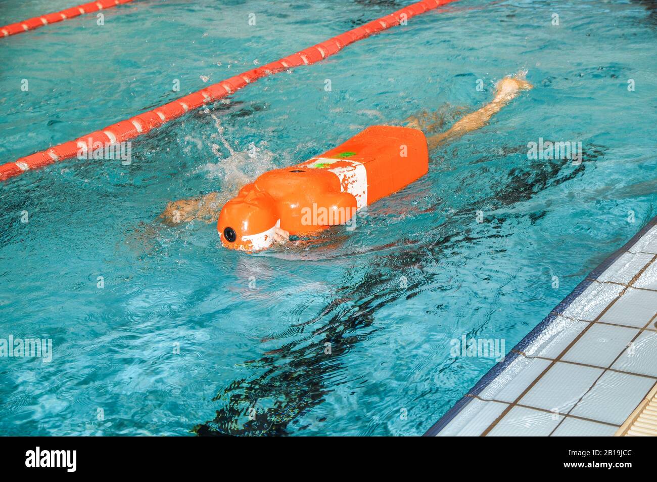 Lifeguard training with rescue dummy in a pool Stock Photo Alamy