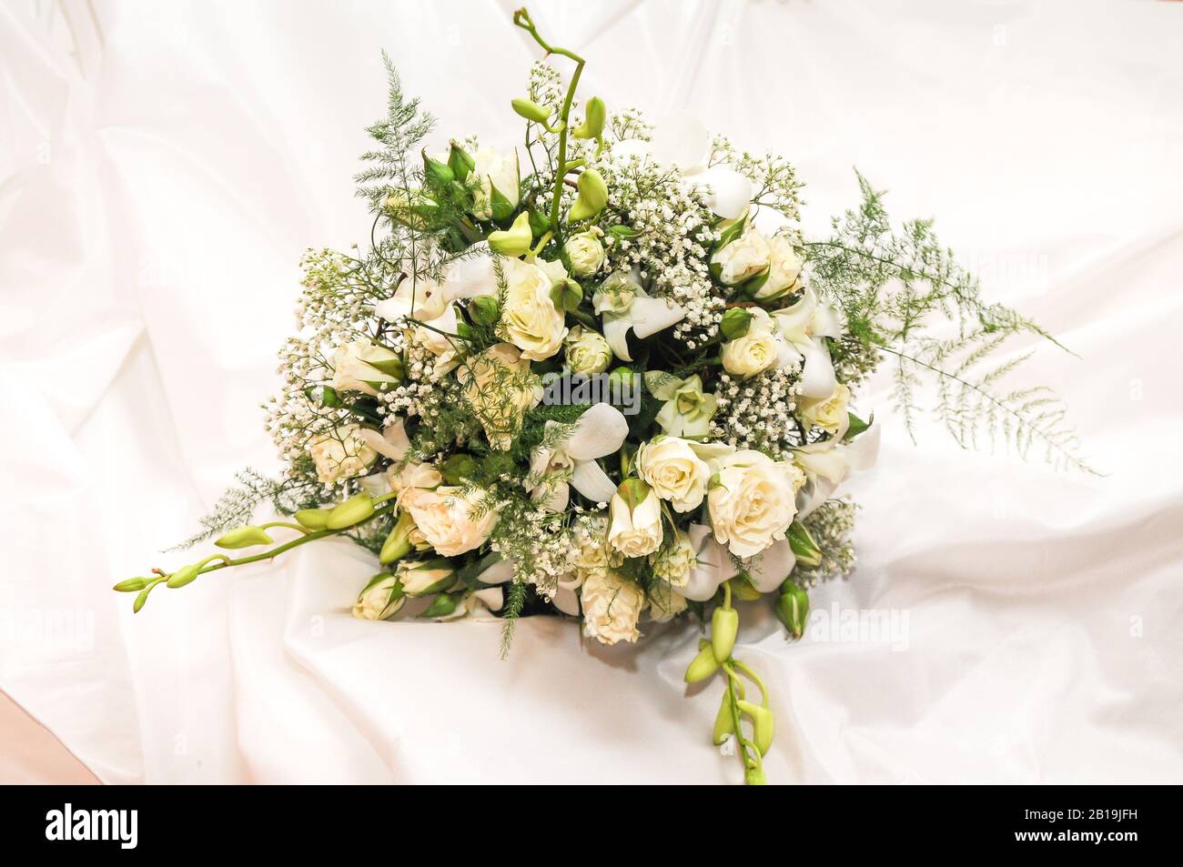 Beautiful wedding bouquet with white flowers. Stock Photo