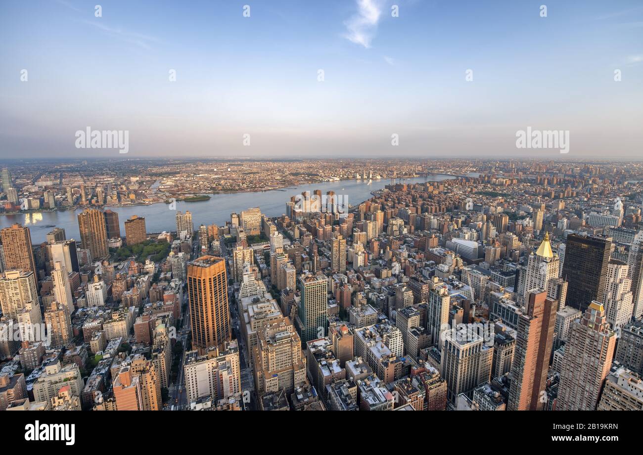 Sunset aerial view of Midtown Manhattan skyscrapers from a high