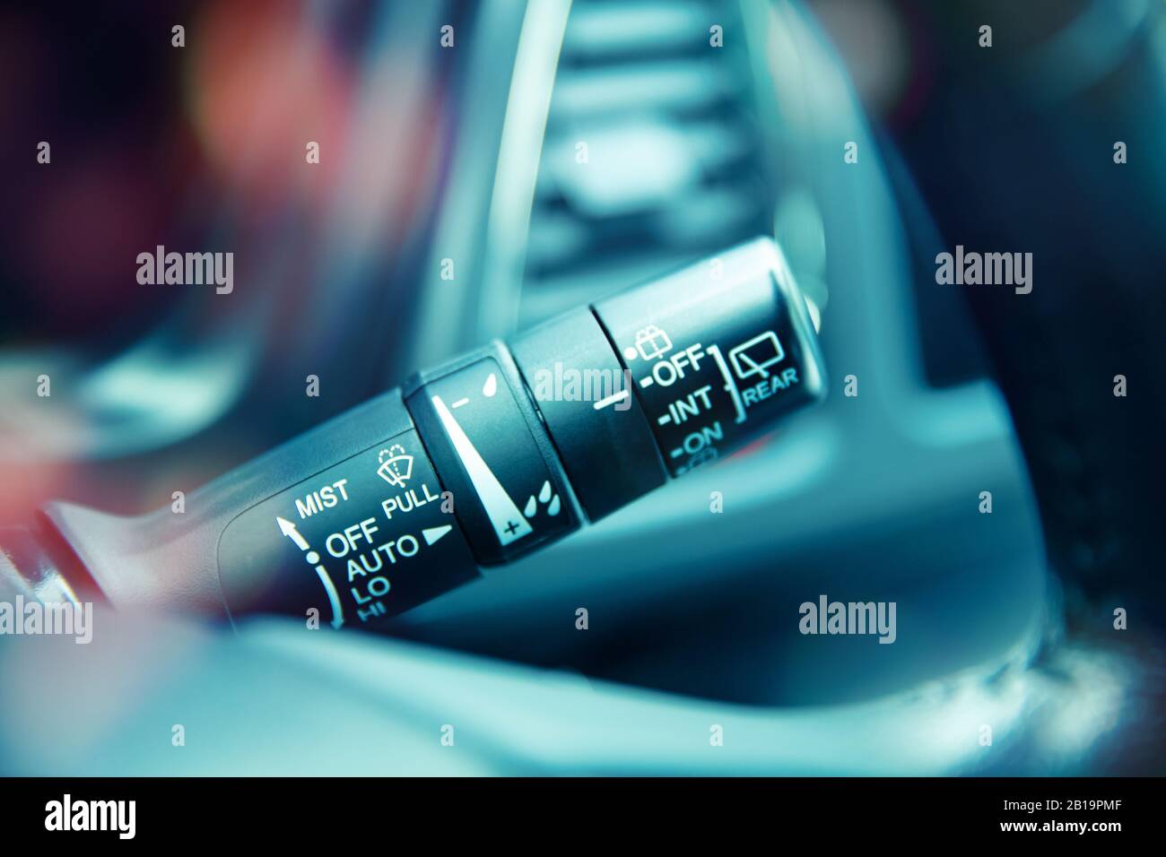 Closeup of a control handle for windshield wipers and washers in a car