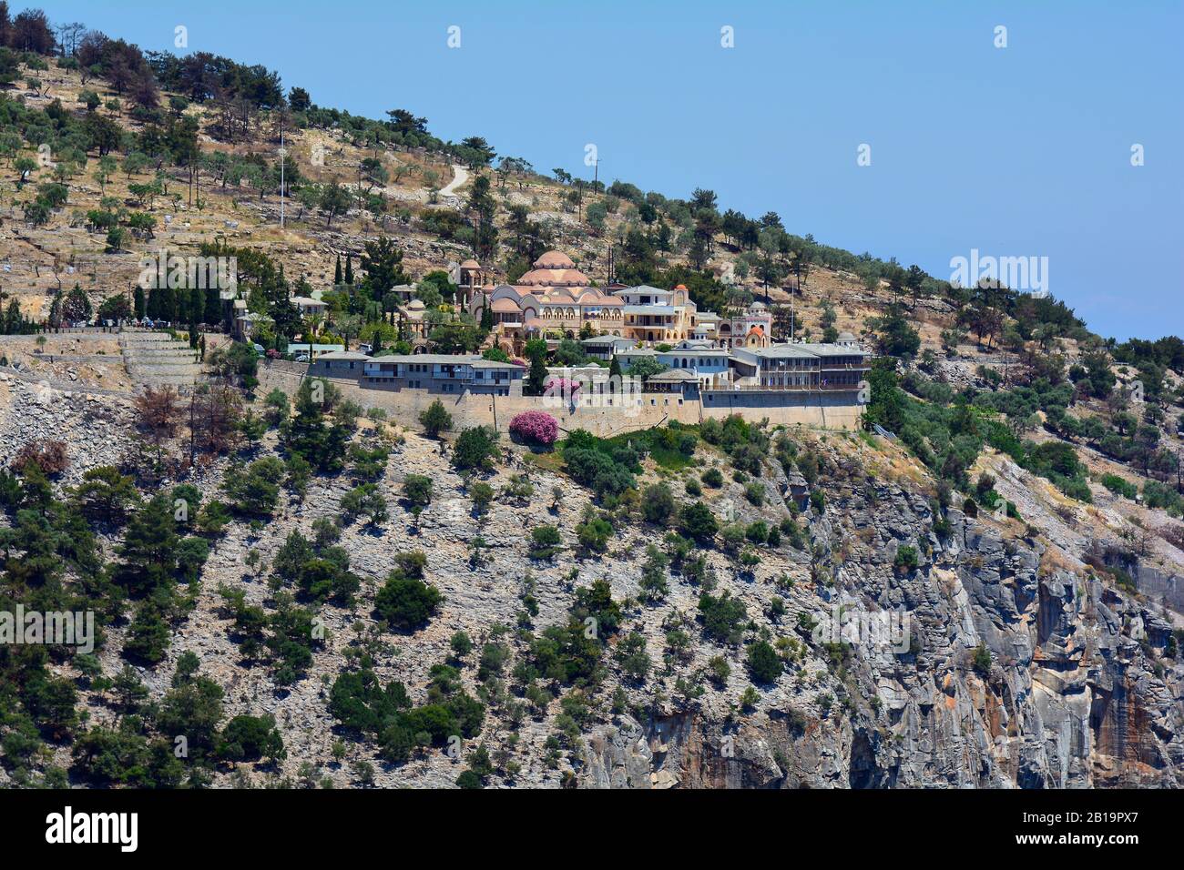 Greece, Thassos Island, monastery Archangelou built on cliff coast to Aegean sea Stock Photo
