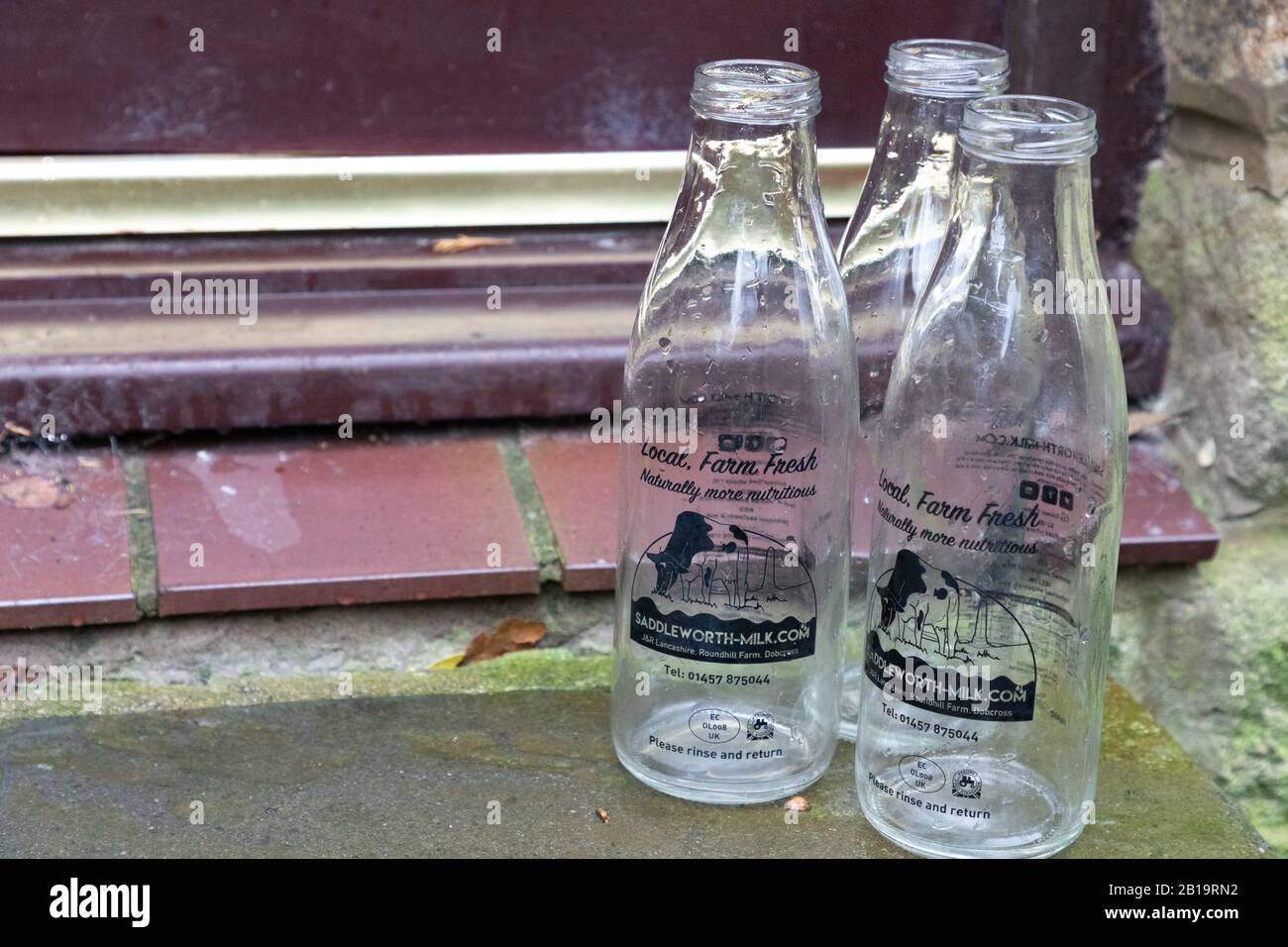 Oldham, UK, February 24th 2020: Newly distributed 1litre reusable milk bottles for doorstep milk delivery from the Saddleworth Dairy company. Stock Photo