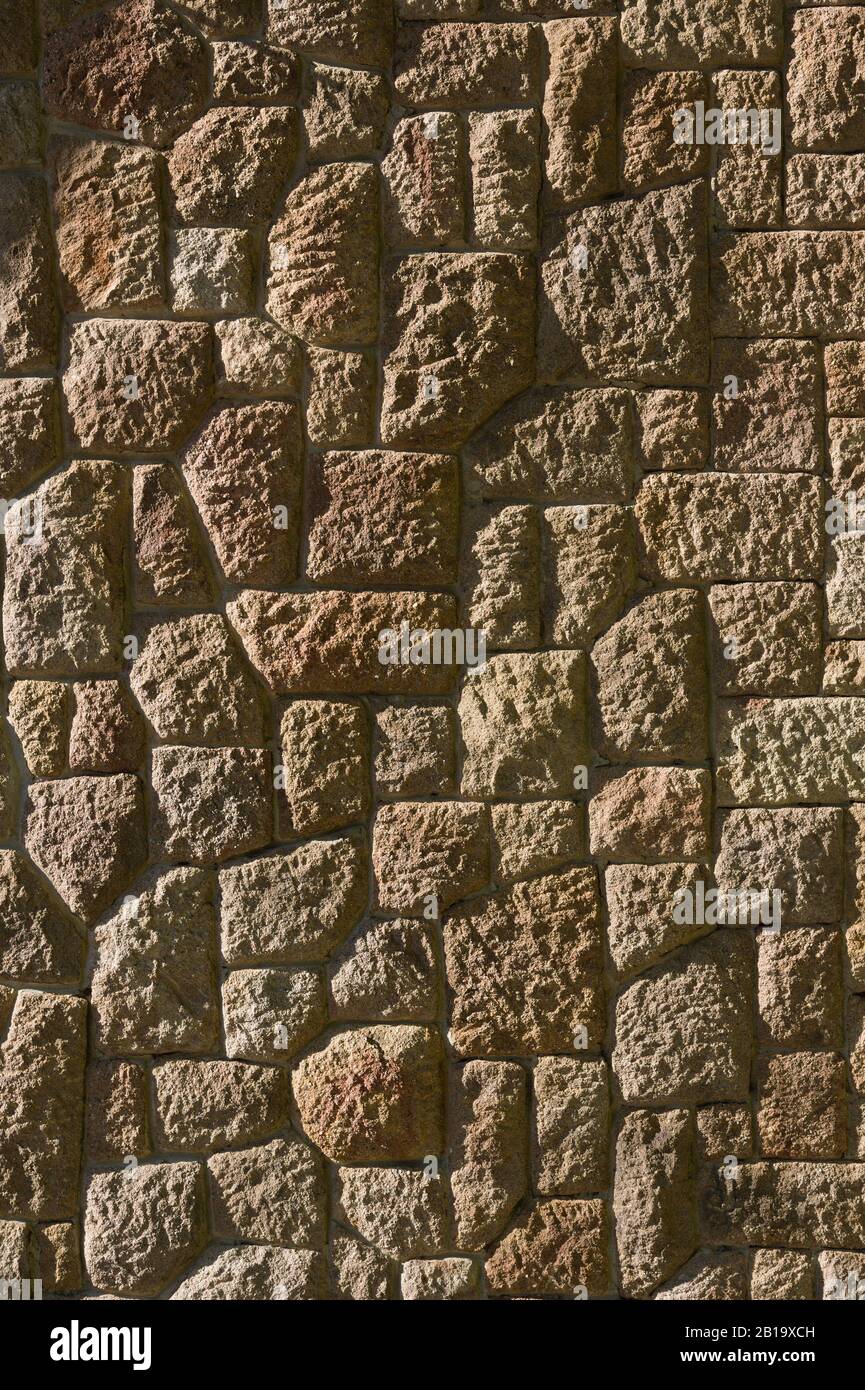 Dry stone wall texture background, in searing light. Stock Photo