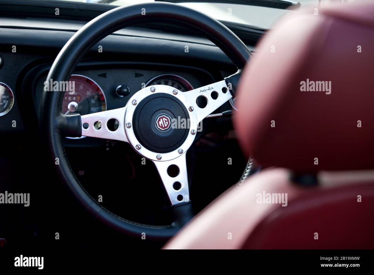 Moto-Lita Steering wheel in Black leather fitted to a MGB Stock Photo -  Alamy