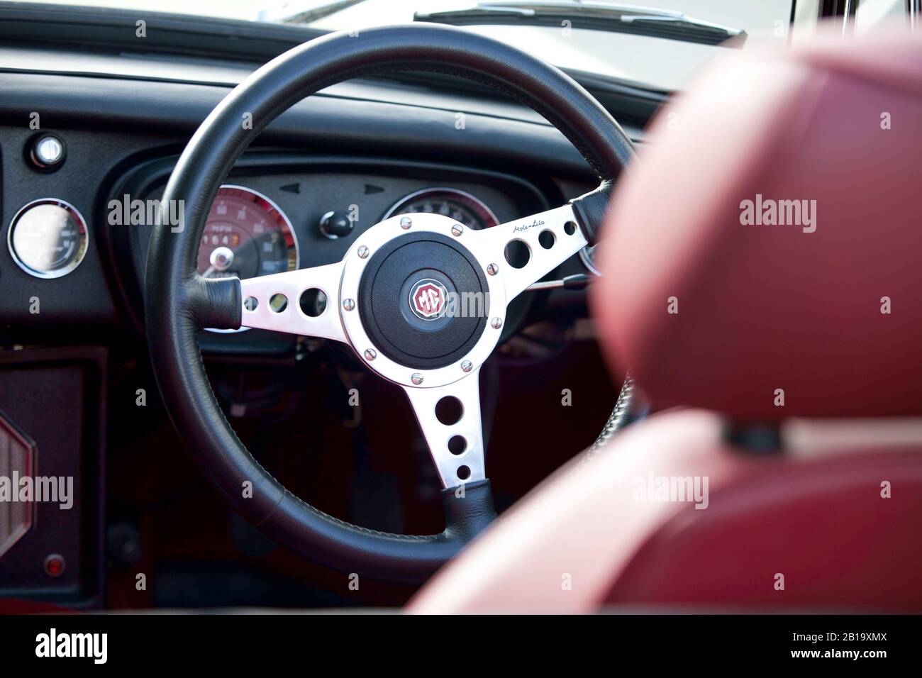 Moto-Lita Steering wheel in Black leather fitted to a MGB Stock Photo -  Alamy