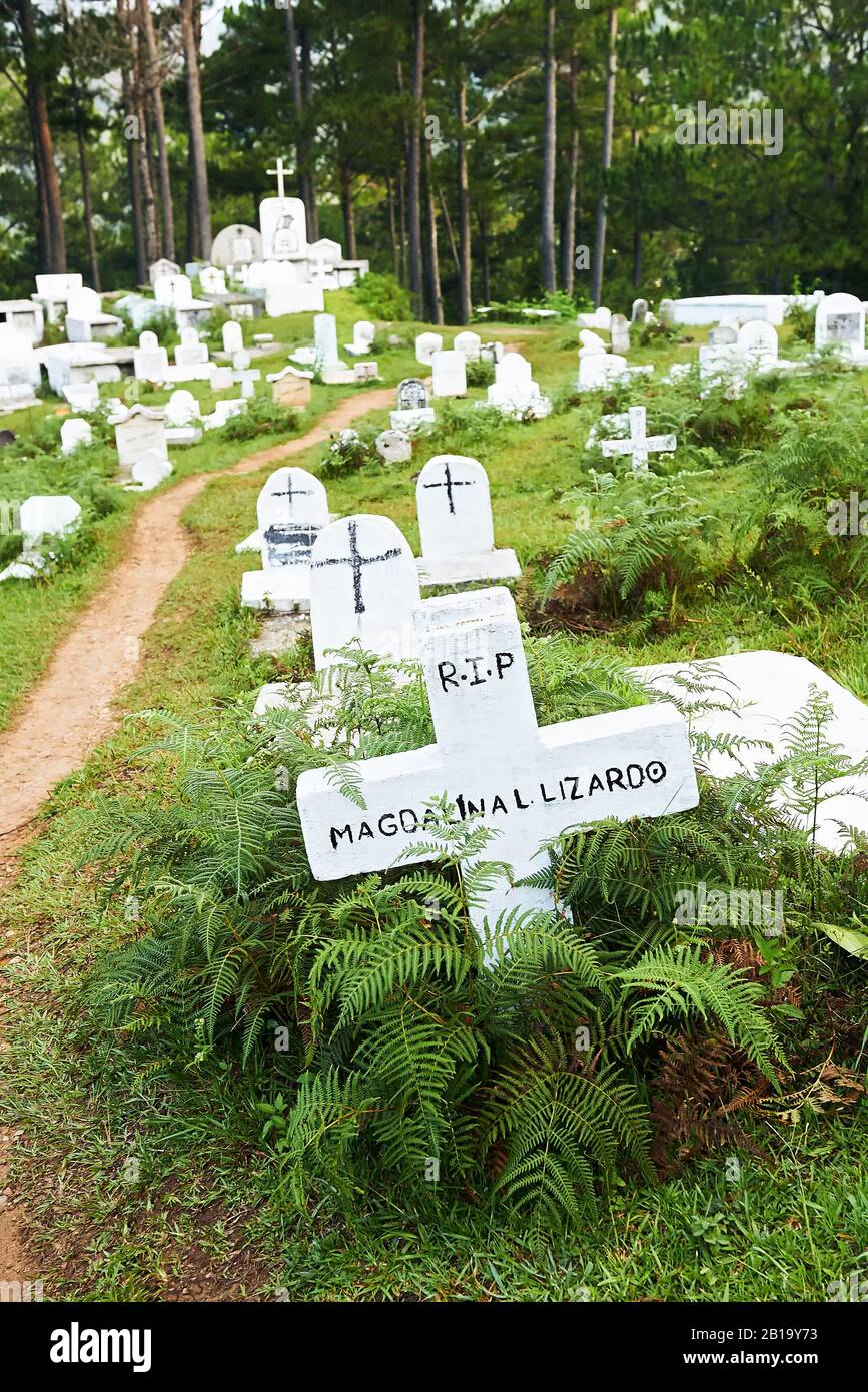 Sagada, Mountain Province, Philippines: Traditional white painted grave stones at the cemetery on a hill close to the town centre Stock Photo