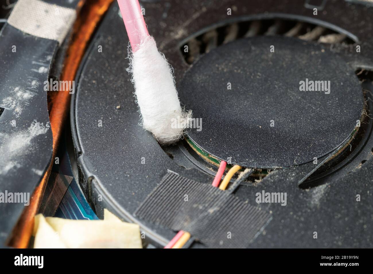 Cleaning a laptop's cooling system with a cotton swab Stock Photo Alamy