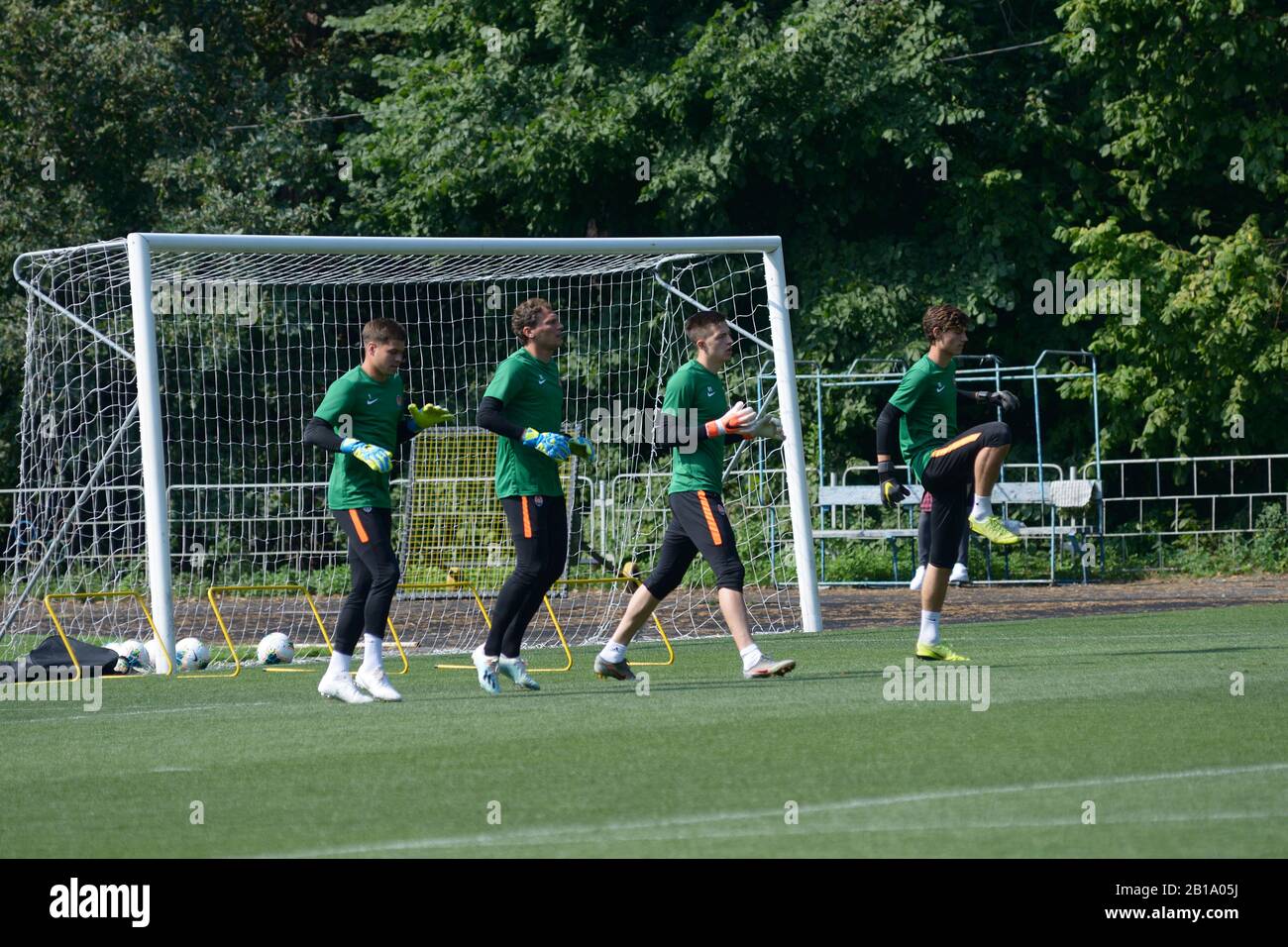 Goalkeepers warming up before training in front of a football goal on a stadium. Shakhtar soccer team, sport base Sviatoshyn. August 5, 2019. Kiev, Uk Stock Photo
