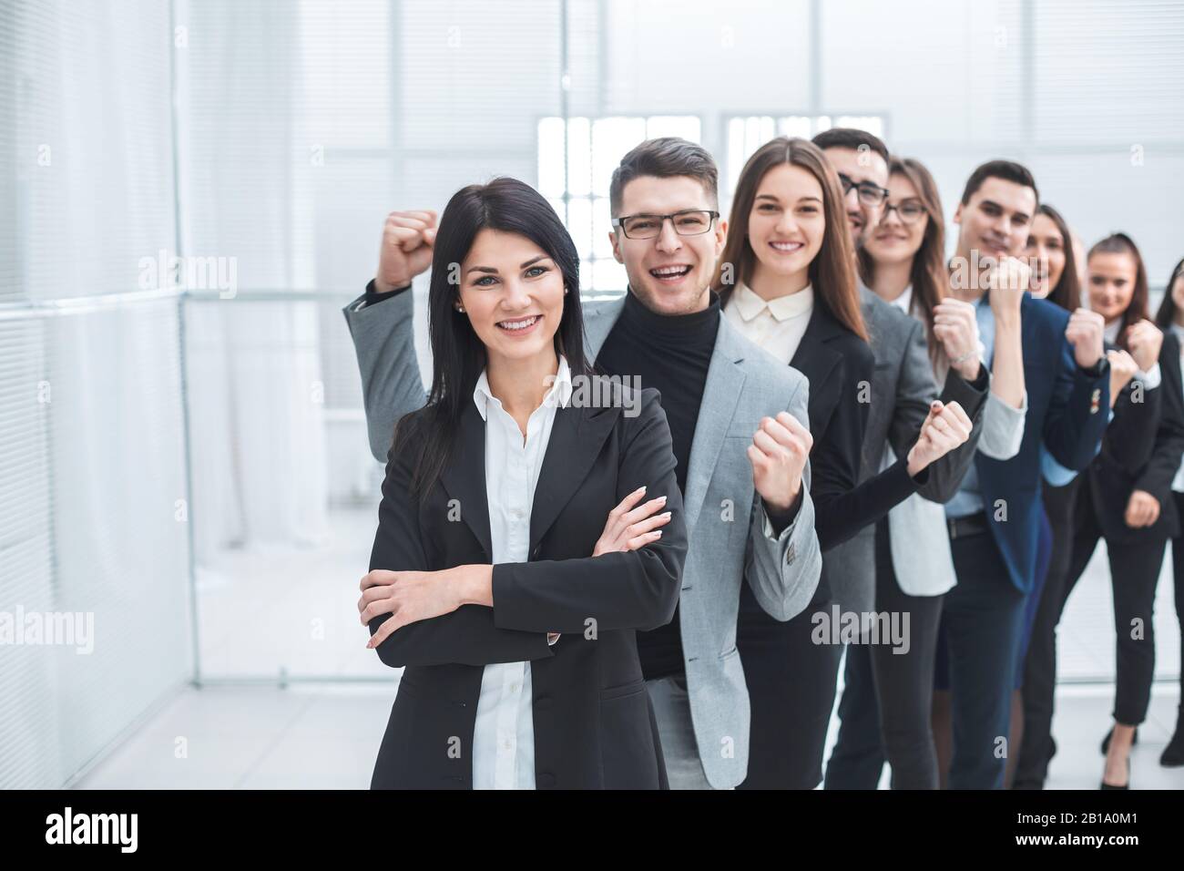 group of happy young people standing in a row Stock Photo - Alamy