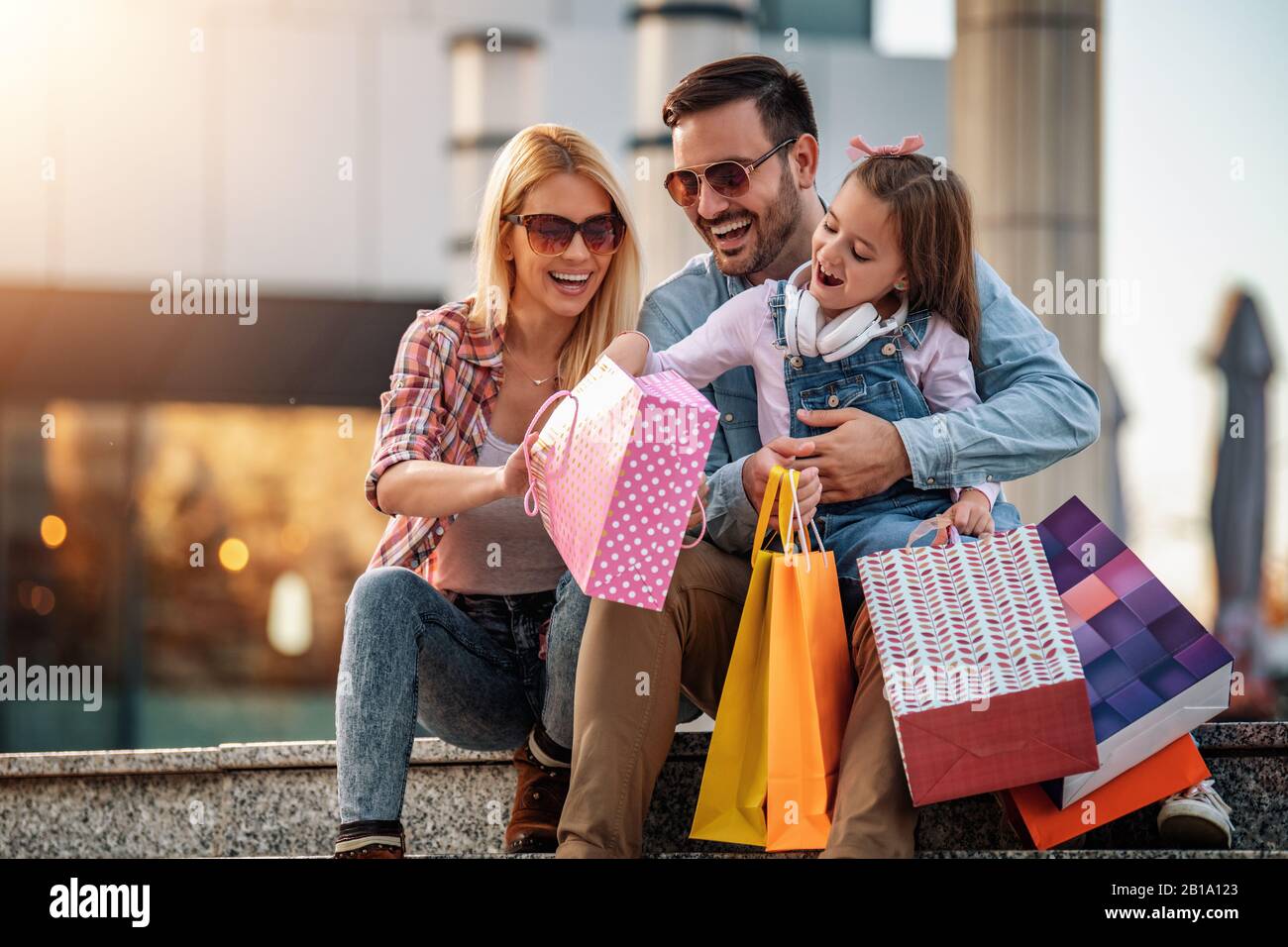 Happy family with shopping bags.Family shopping.Young parents and their