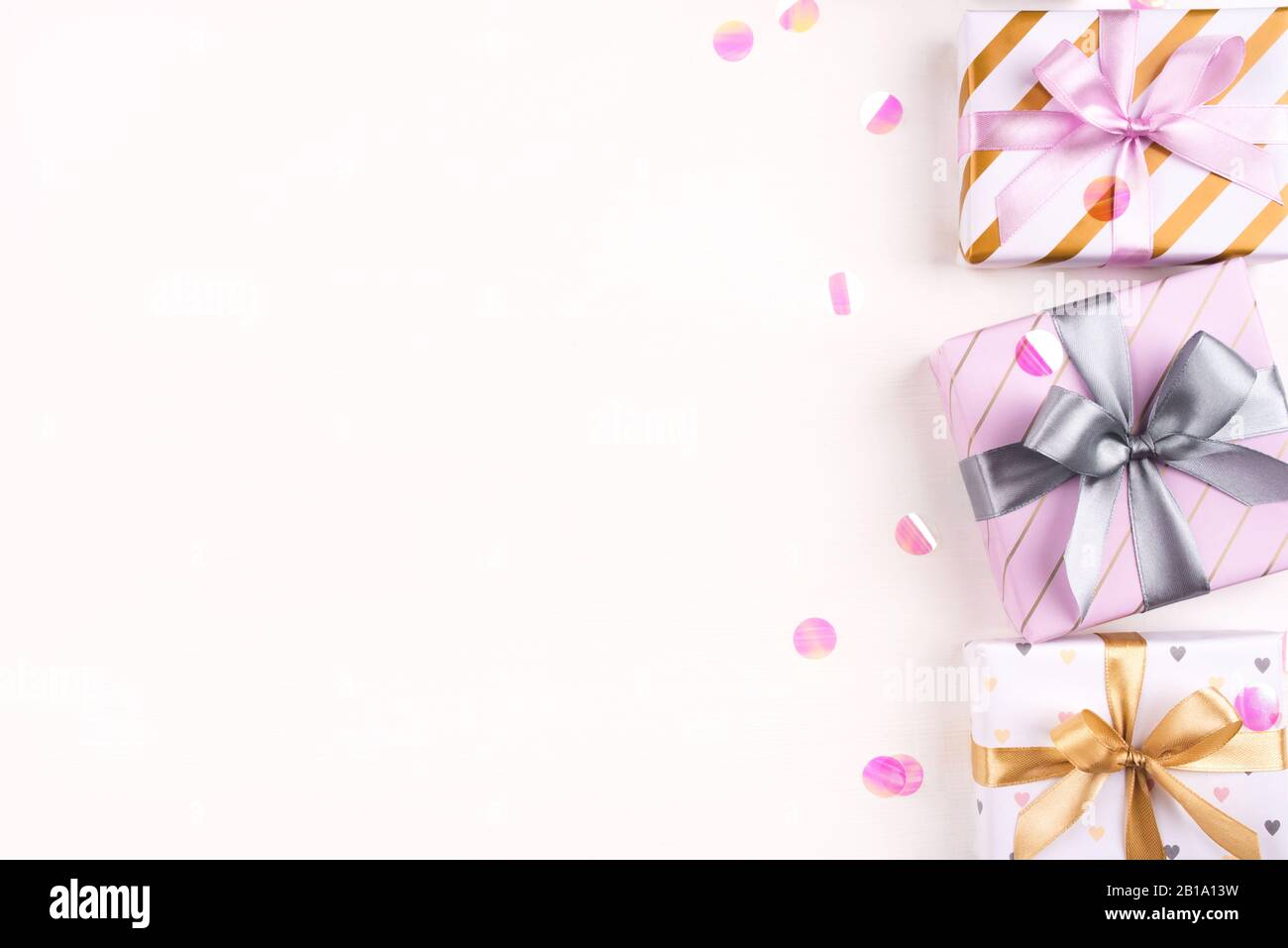 Set of gift boxes with bows and confetti on a white background Stock ...