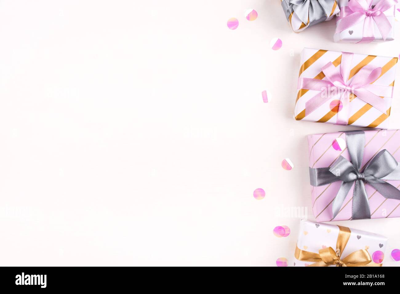 Set of gift boxes with bows and confetti on a white background Stock ...