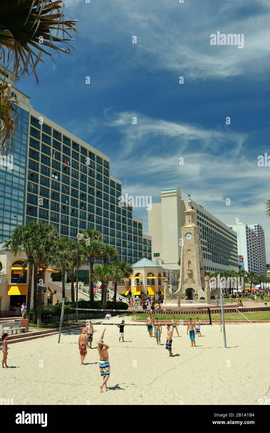 Game of beach volleyball, Daytona Beach, Florida, United States of America, with the Coquina Clock Tower in the background. Stock Photo