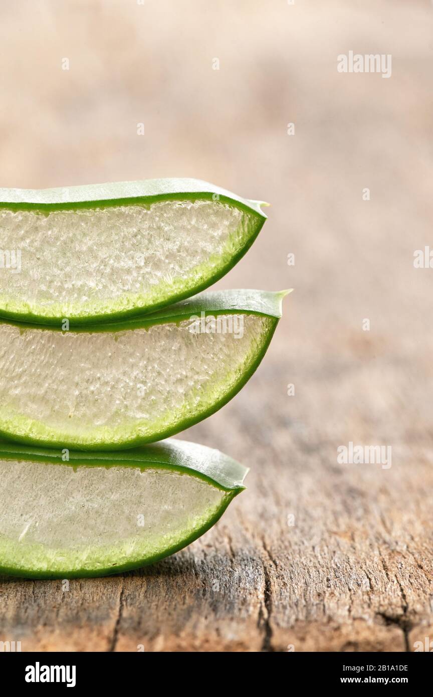 Slices Of Aloe Vera Leaves on Wooden Table Stock Photo