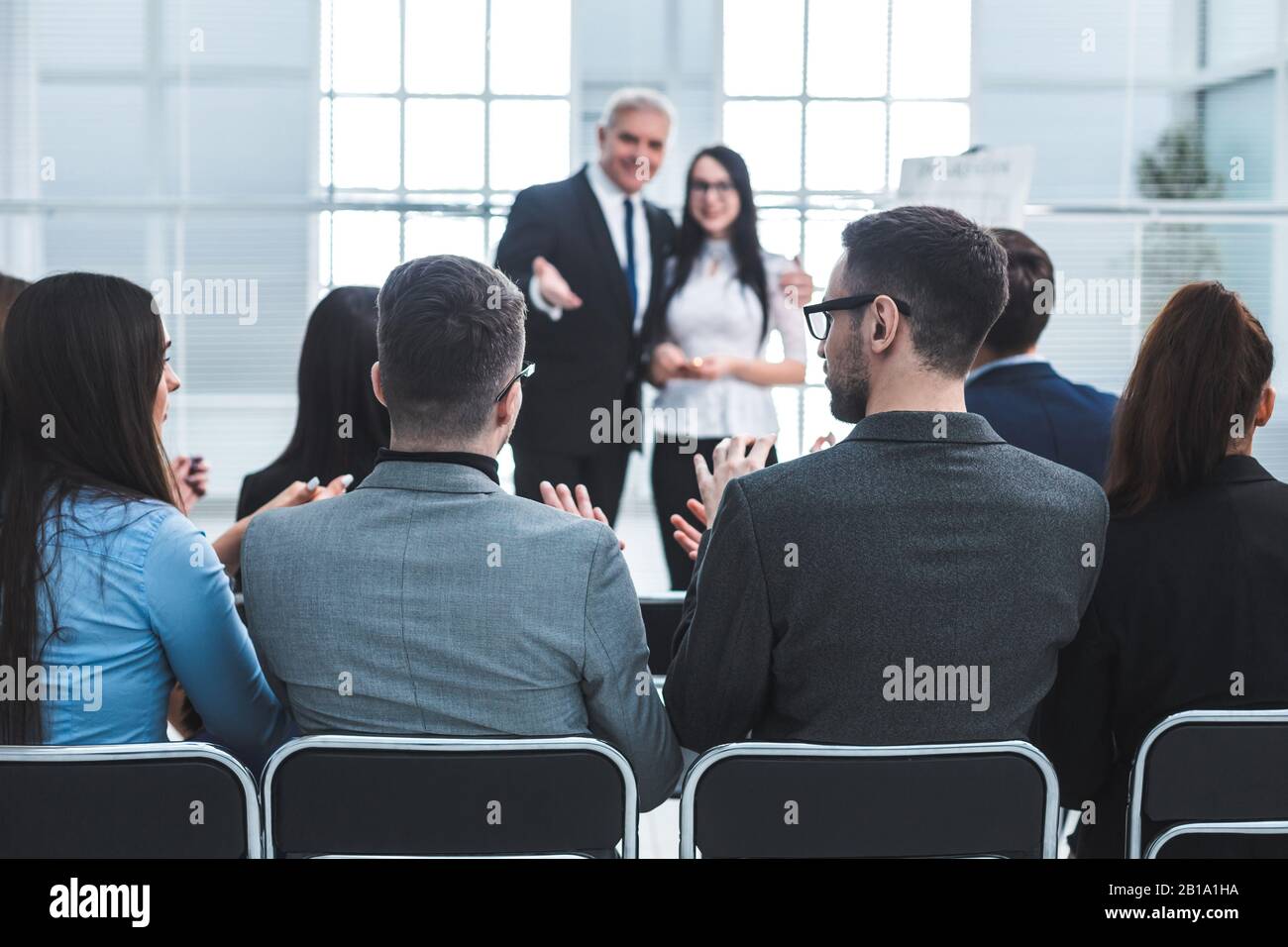 boss representing a young specialist during a work meeting. Stock Photo