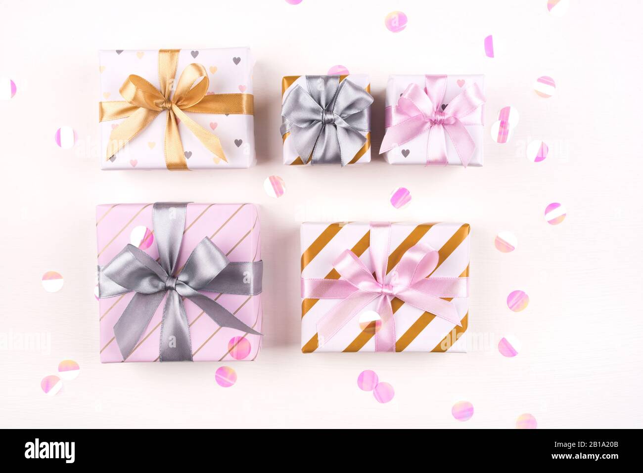 Set of gift boxes with bows and confetti on a white background Stock ...