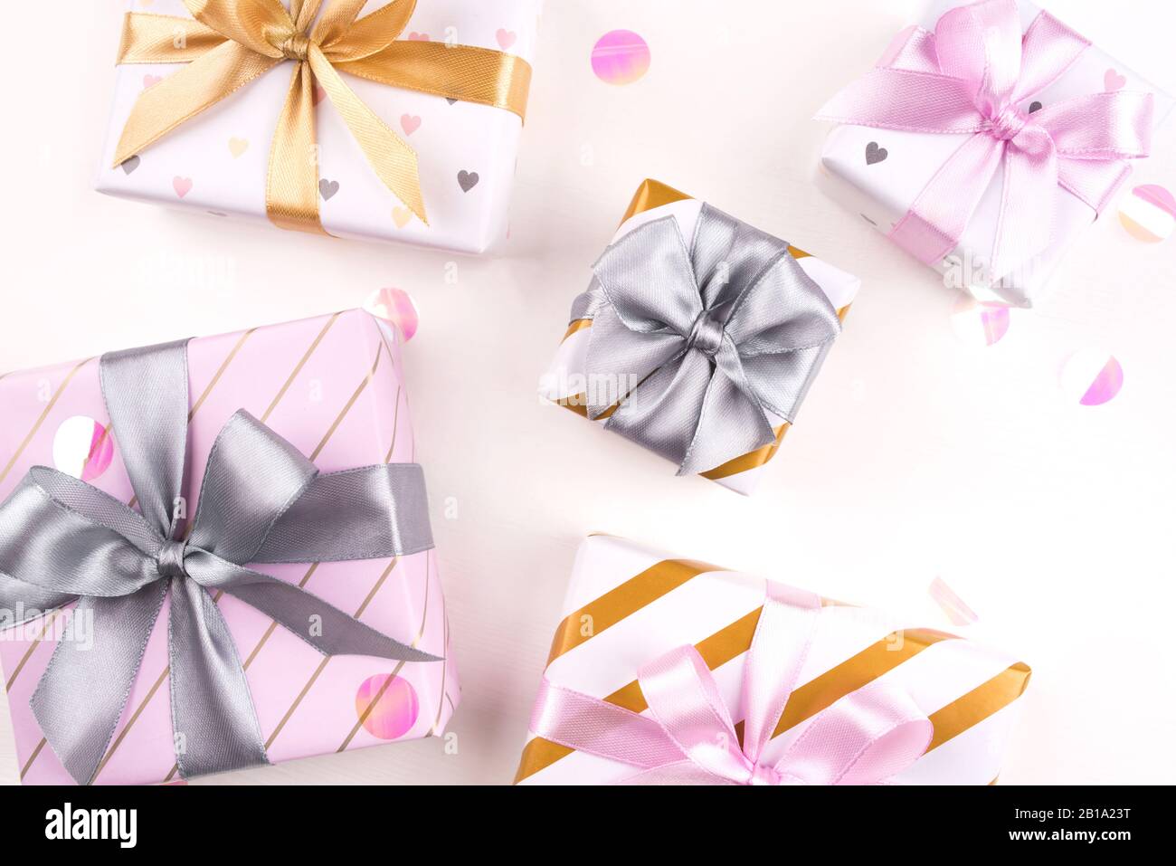 Set of gift boxes with bows and confetti on a white background Stock ...