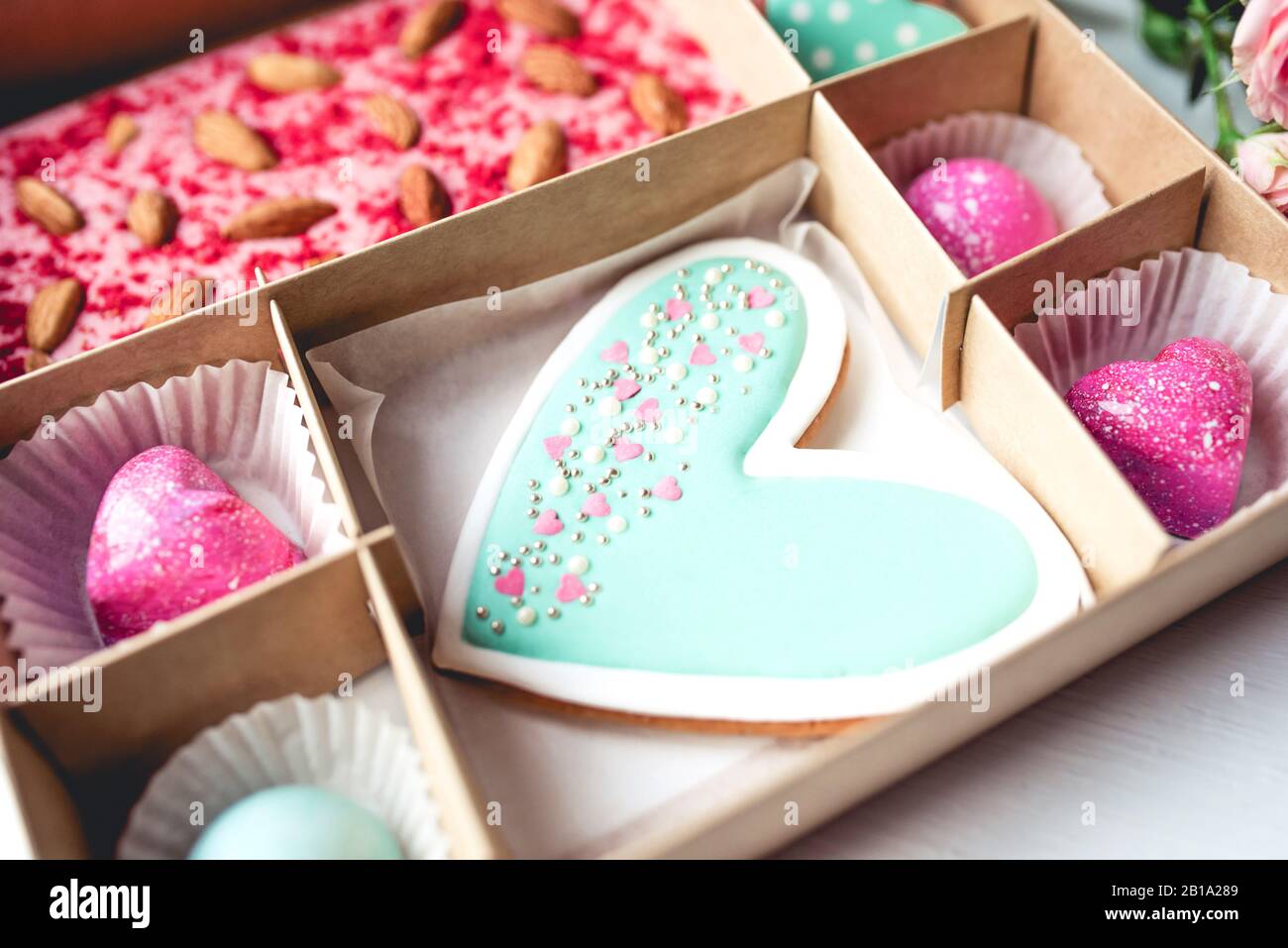 Gift set with hand made sweets in a box on a white table. Stock Photo