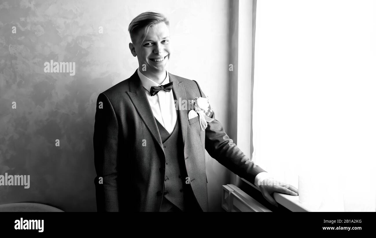 close up. brooding groom standing near the window Stock Photo - Alamy