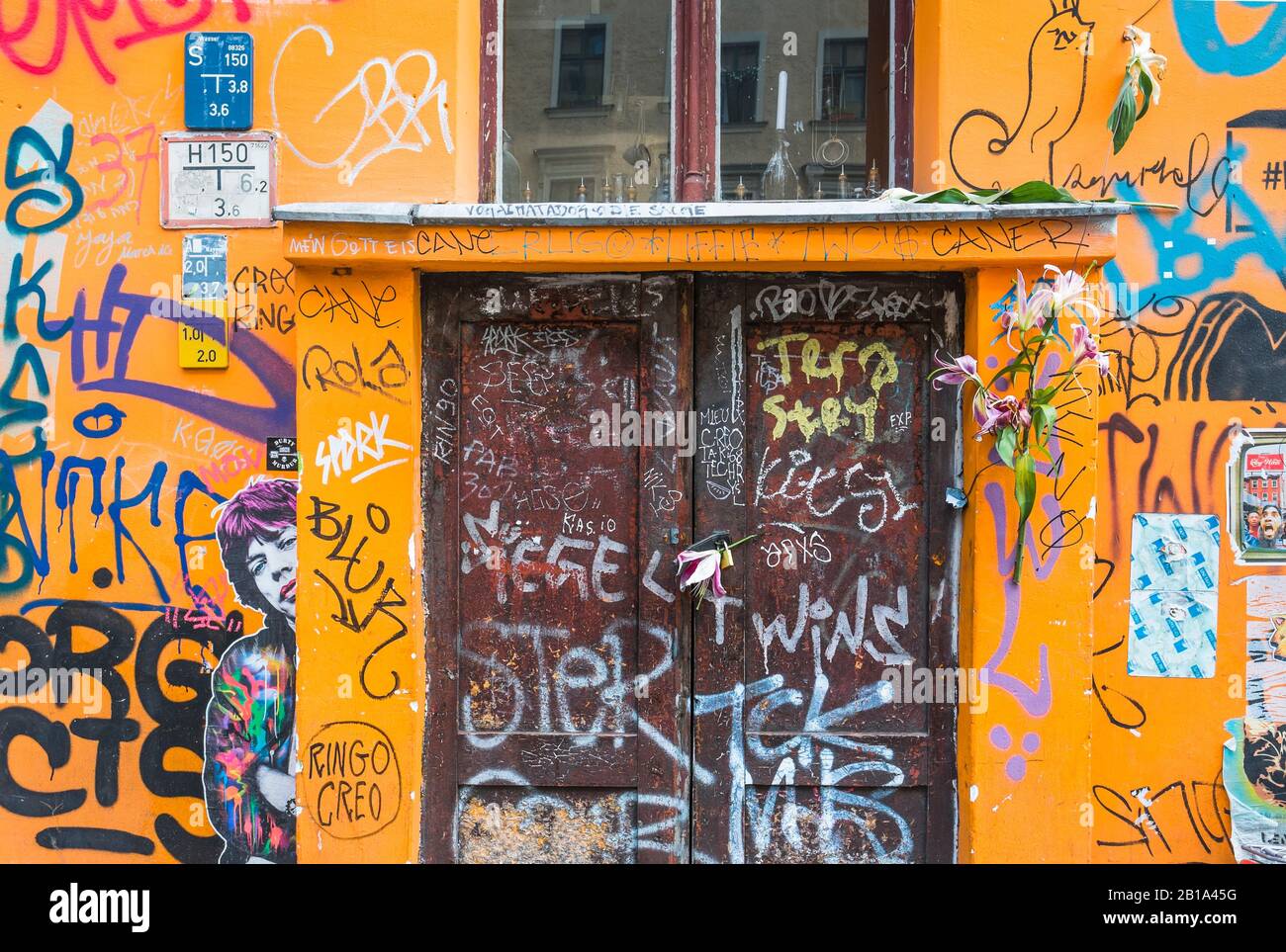 red house door, graffiti, wheatpaste art, Stock Photo