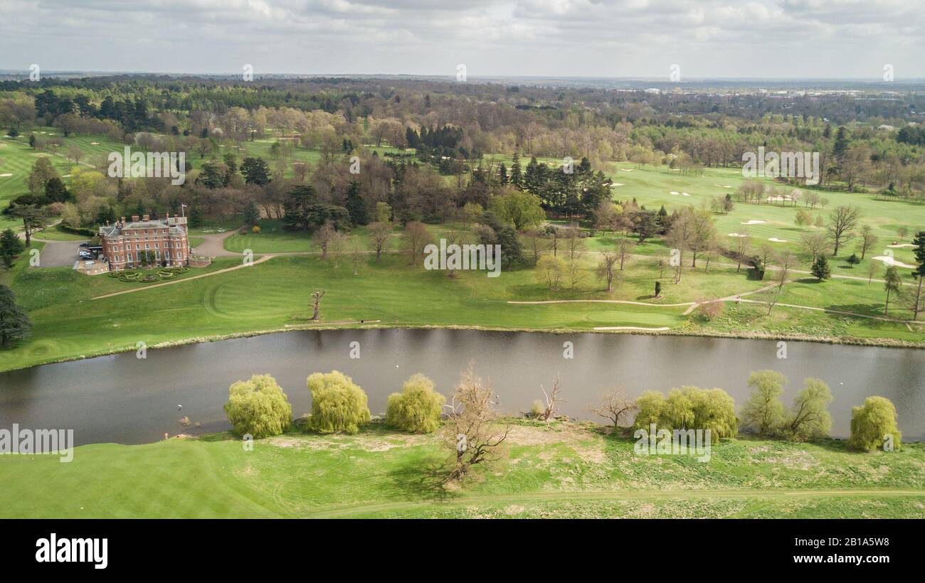 Brocket Hall, Hertfordshire, England. Aerial view of the landmark stately home with landscaped grounds dominated by Broadwater lake and golf course. Stock Photo