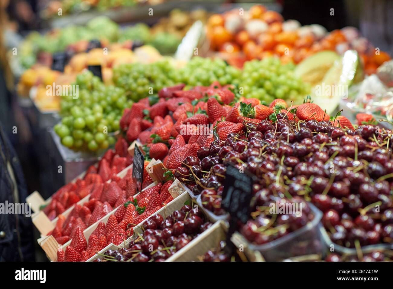 Colorful berries and fruits in Spanish market hall Stock Photo Alamy