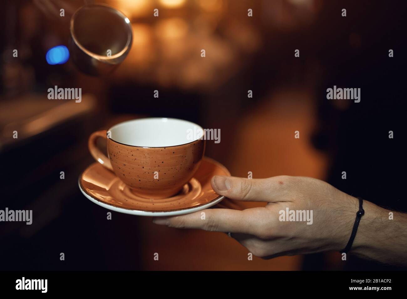 man holding an empty cup, male asking to pour tea or coffee, give me some  coffee, please. close up cropped photo, blurred background Stock Photo -  Alamy