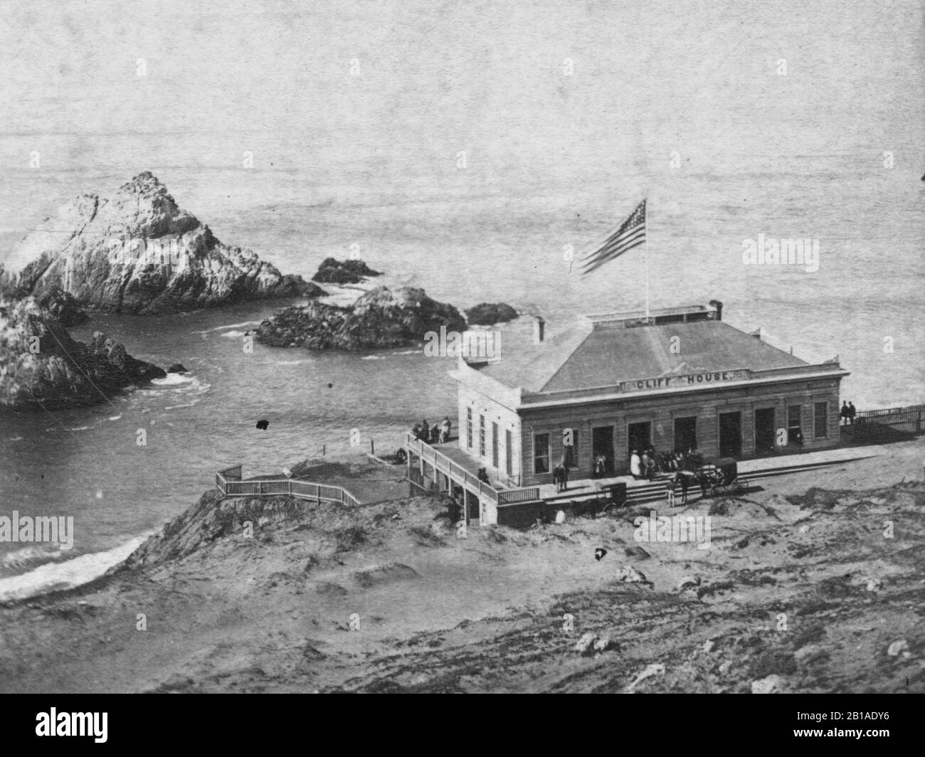 Cliff House, San Francisco, California, USA, 1870s. This is the second building of this name, built in 1863. Since this second house, the Cliff House has been rebuilt four more times over the last 150 years. This house has been a big tourist attraction since early on. The first ever ship-to-shore Morse Code transmission was received in this house in 1899.   To see my other Places-related vintage images, Search:  Prestor  vintage  places  west Stock Photo