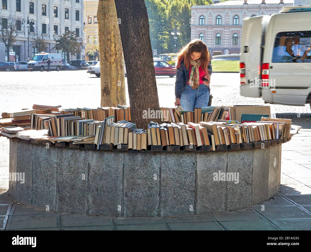 women customer in a second hand book stall in Tbilisi city Georgia Stock Photo