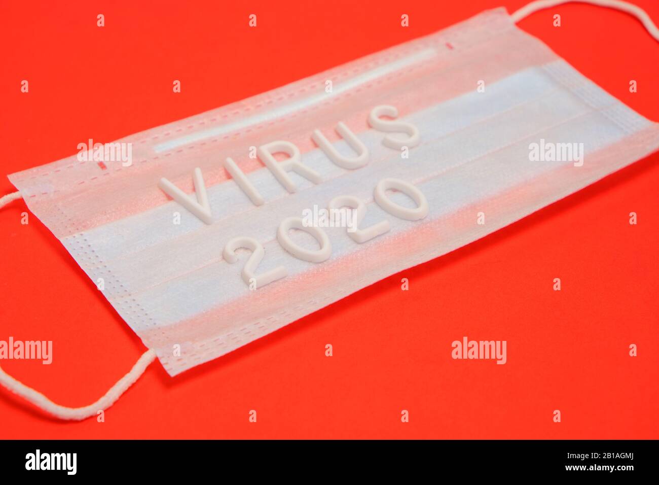 Medical mask for protection and the inscription virus 2020 on a red ...