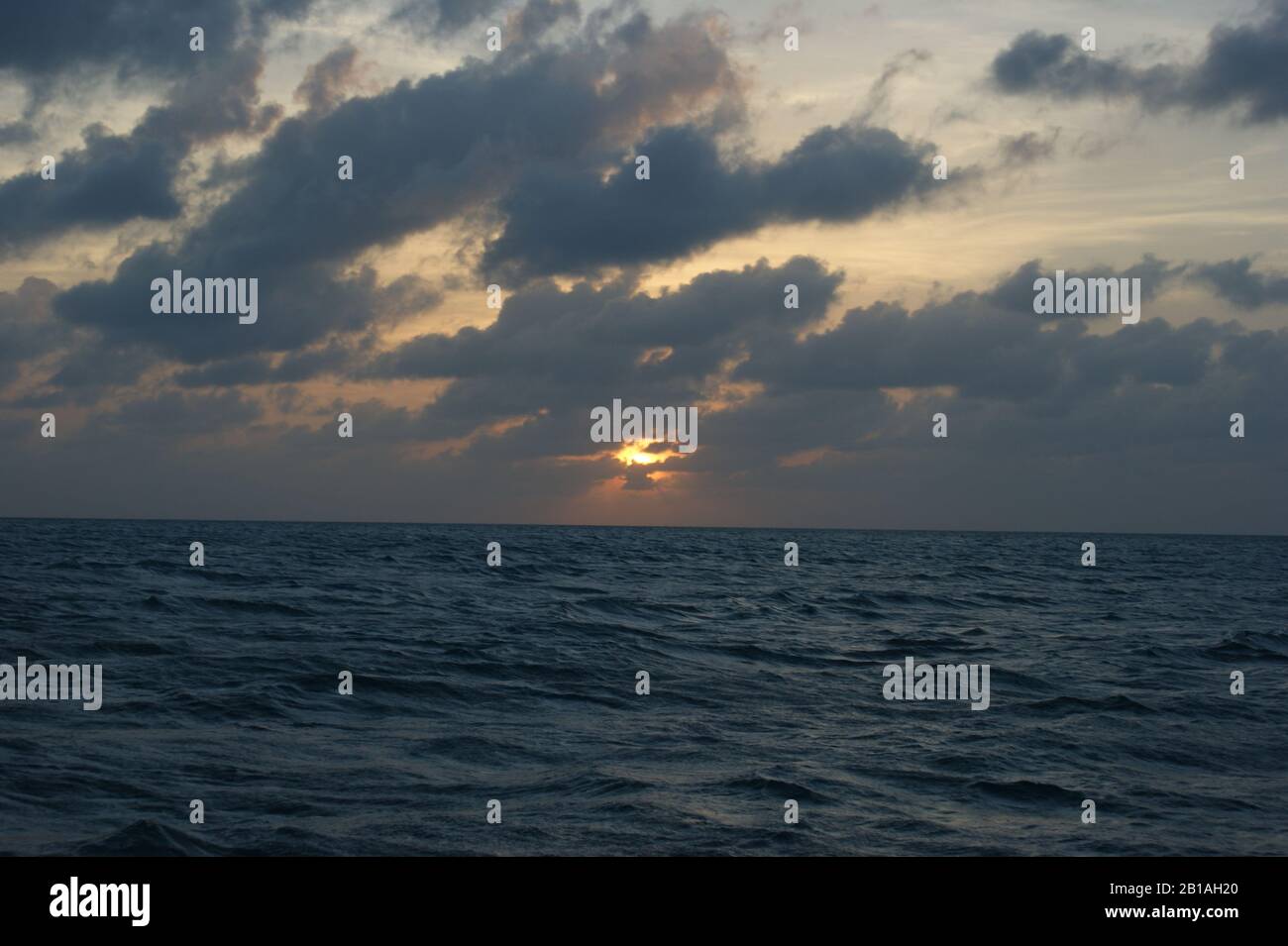 Cloudy sunset above the sea Stock Photo - Alamy