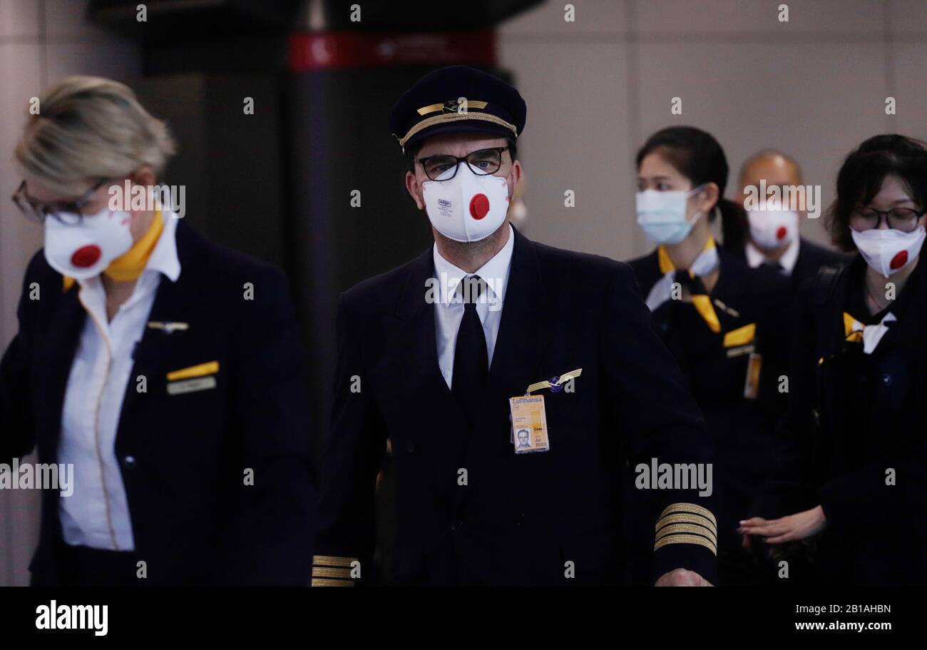 Hong Kong, China. 24th Feb 2020. Lufthansa Pilot and cabin crew, all wearing protective face masks exit from the arriving hall at Hong Kong International Airport.Feb-24, 2020 Hong Kong.ZUMA/Liau Chung-ren Credit: Liau Chung-ren/ZUMA Wire/Alamy Live News Stock Photo