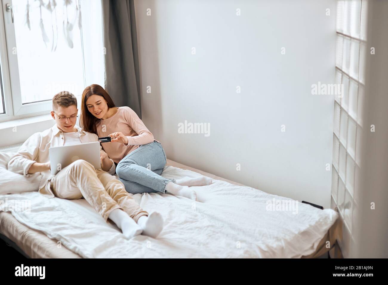 family buying furniture online for their new house, couple renovating