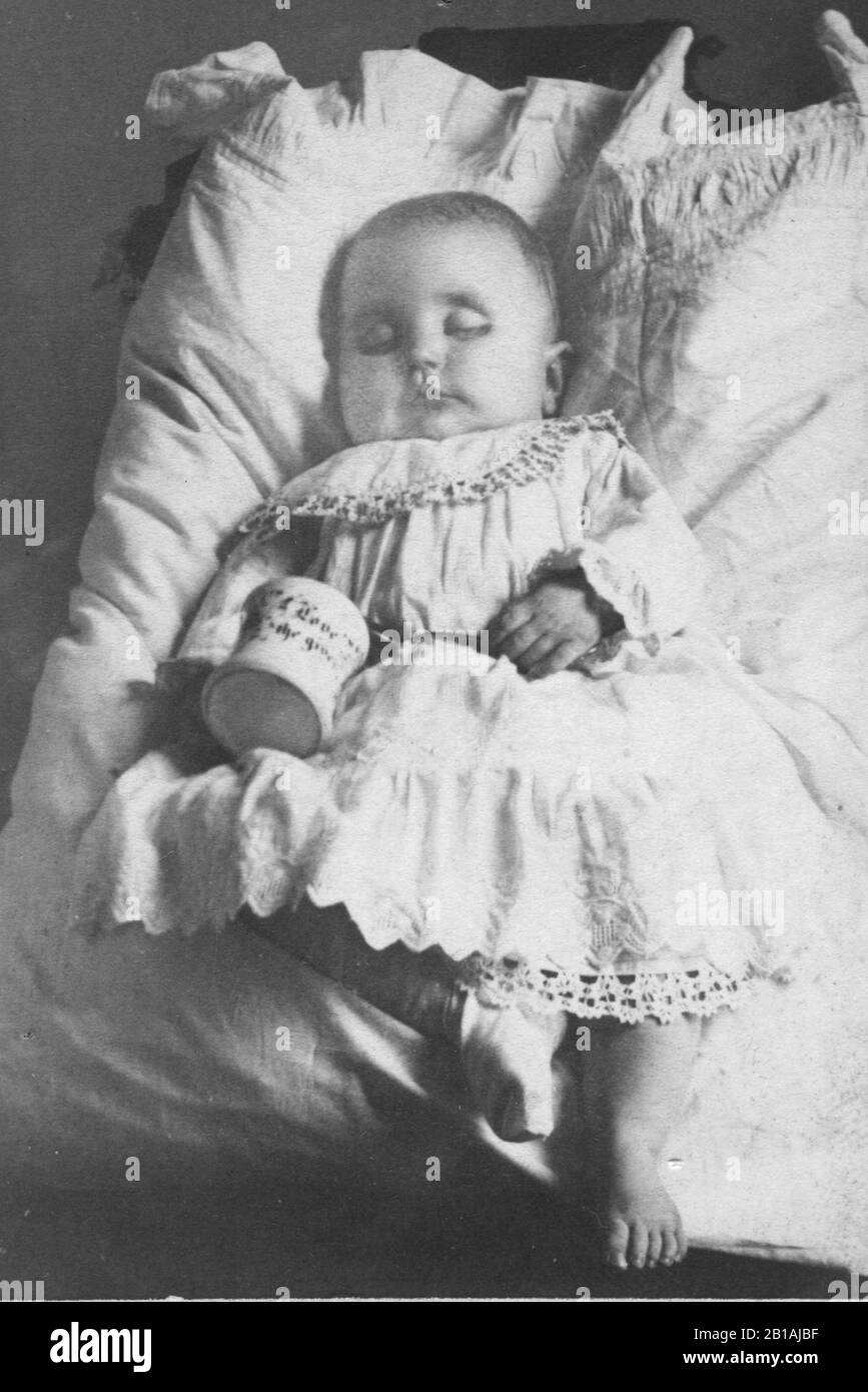 Dead baby. S/he is posed to appear to be simply asleep. In the 1800s
