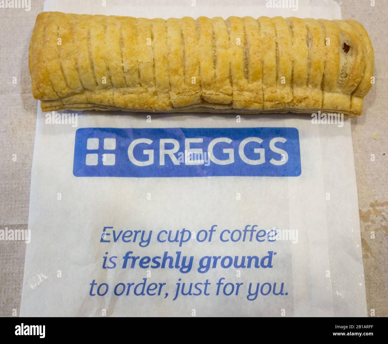 A Greggs veganfriendly sausage roll on a tabletop in a Gregg's cafe Stock Photo Alamy